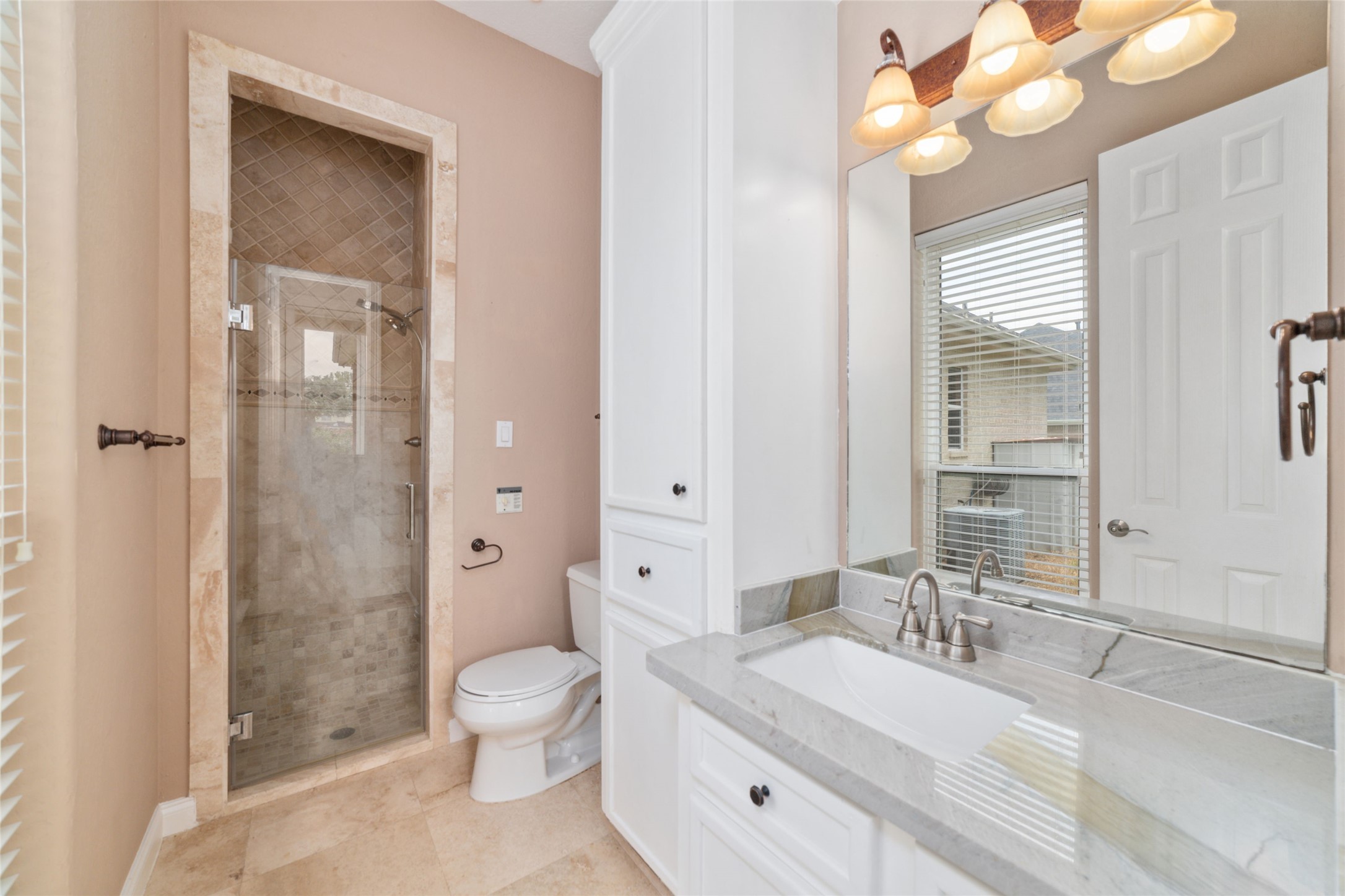 32610 Whitburn Trail Fulshear, TX 77441 - Photo 27 of 49 a bathroom with a sink a toilet and shower