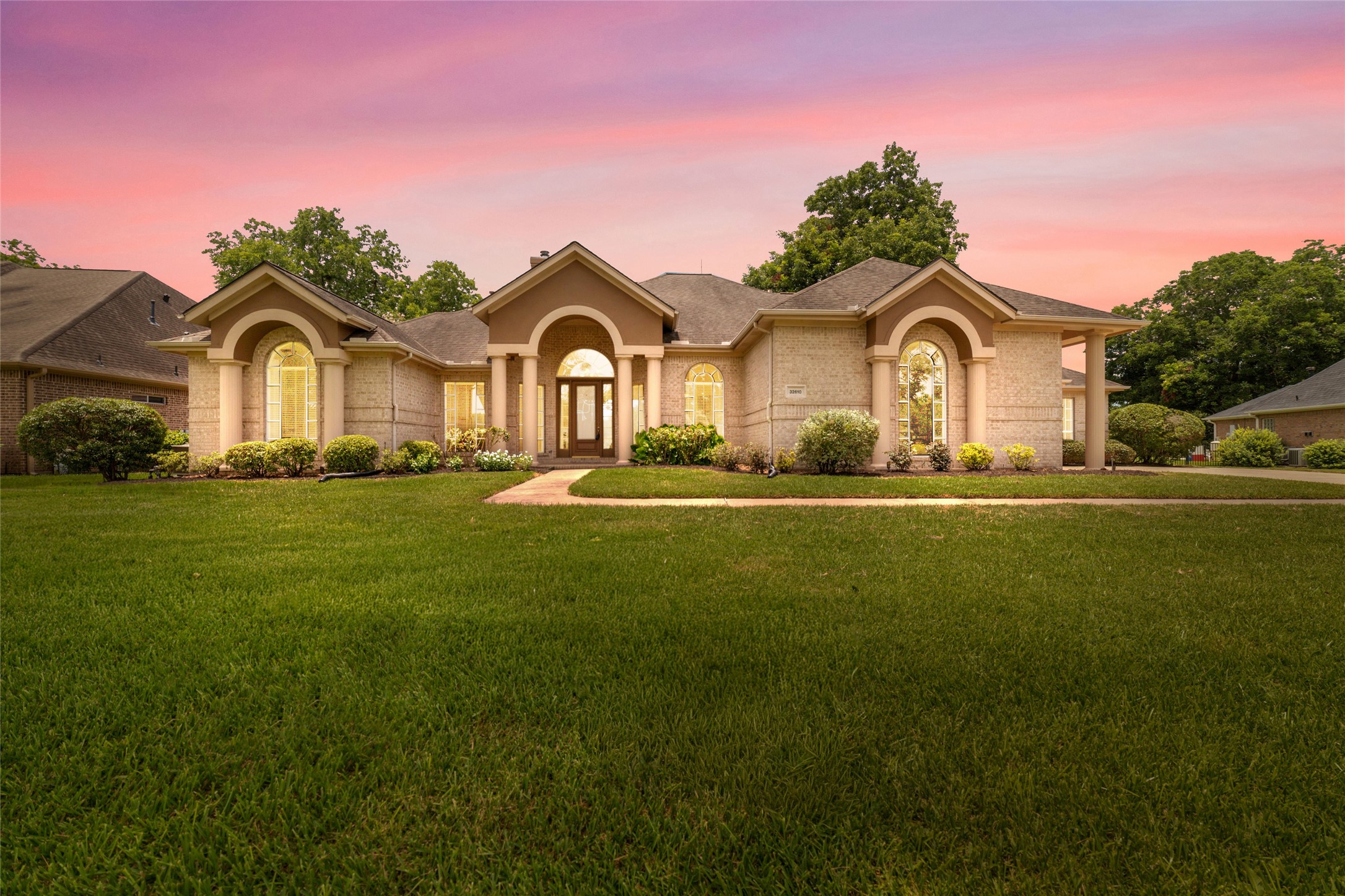 32610 Whitburn Trail Fulshear, TX 77441 - Photo 3 of 49 a front view of a house with a garden