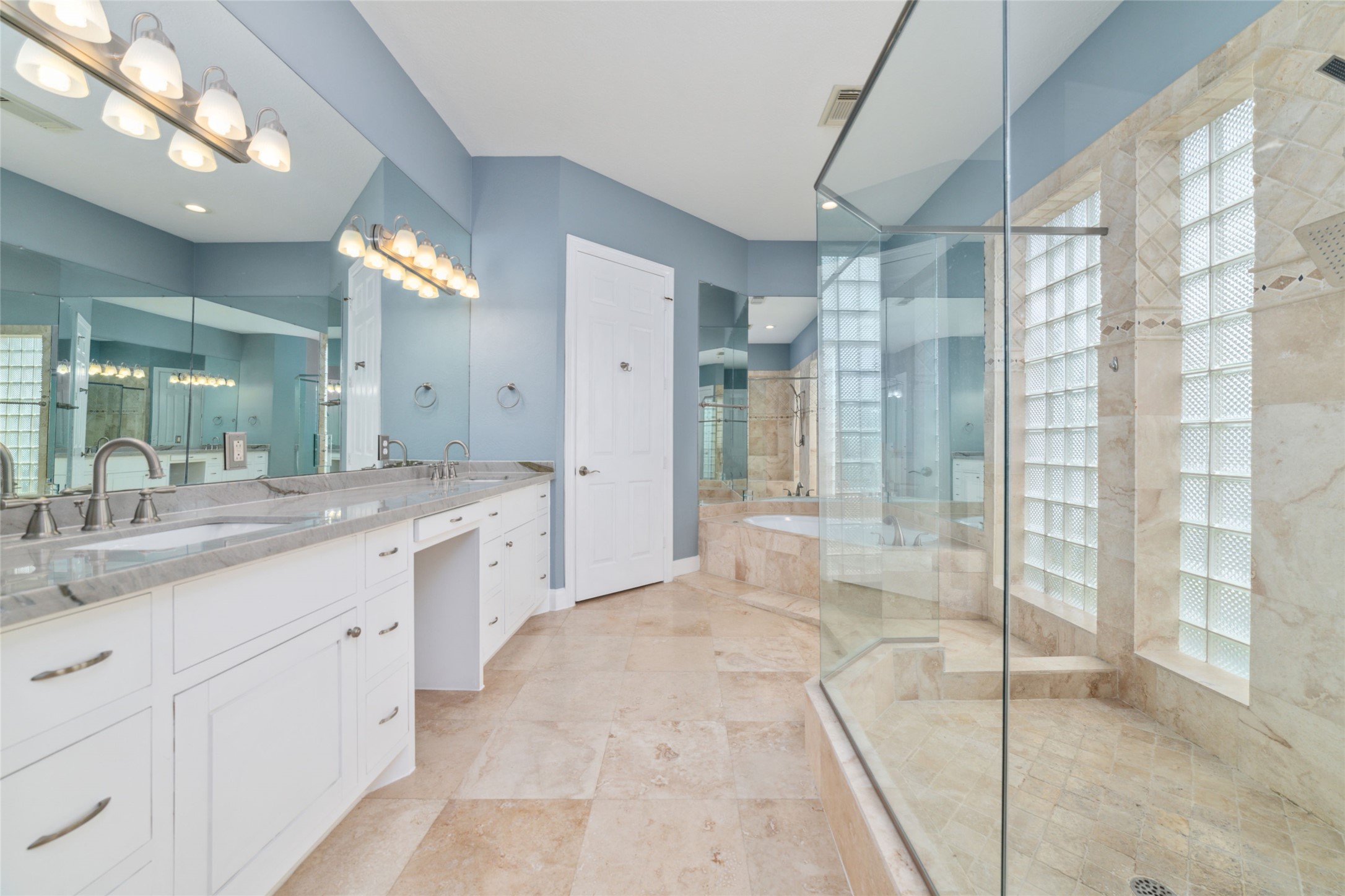 32610 Whitburn Trail Fulshear, TX 77441 - Photo 34 of 49 a spacious bathroom with a granite countertop sink mirror and shower