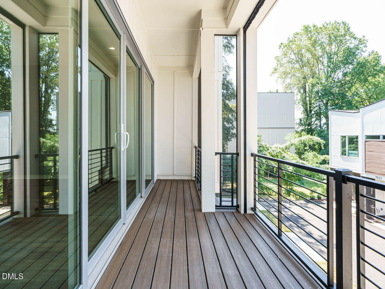 1525 Urban Trace Lane Raleigh, NC 27608 - Photo 12 of 33 a view of a balcony with wooden floor