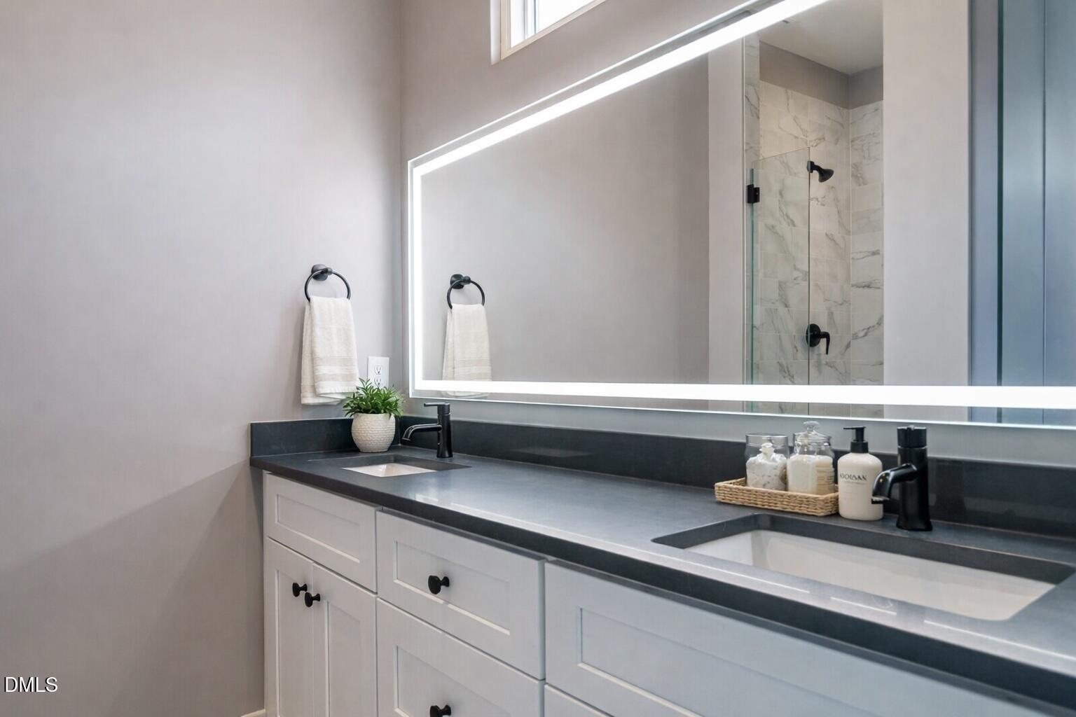 1525 Urban Trace Lane Raleigh, NC 27608 - Photo 17 of 33 a bathroom with a sink and a mirror