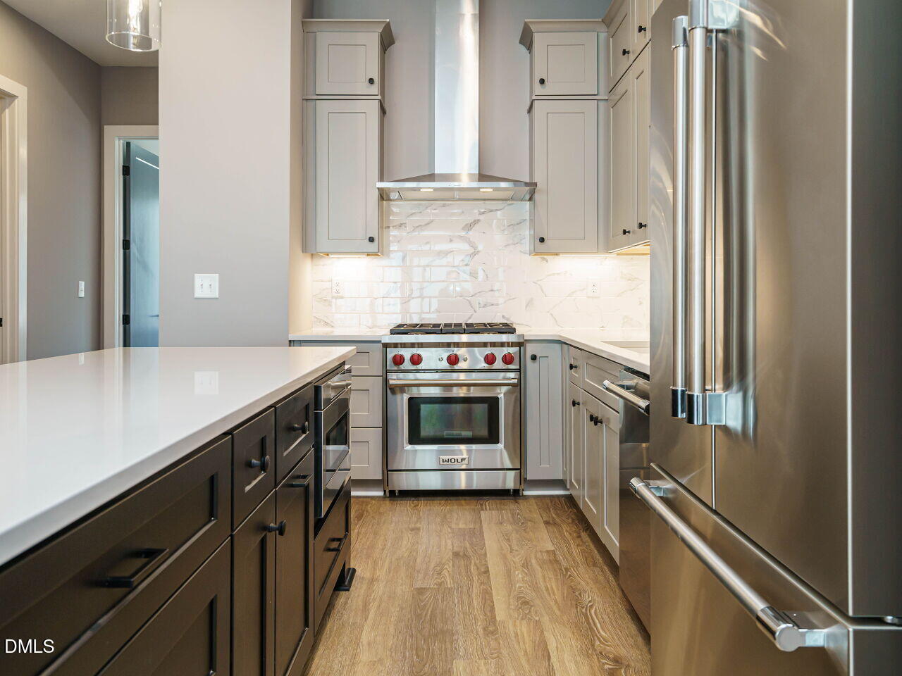 1525 Urban Trace Lane Raleigh, NC 27608 - Photo 8 of 33 a kitchen with a stove and a refrigerator