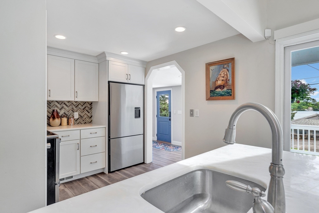 118 Woolford Road Wrentham, MA 02093 - Photo 11 of 41 a kitchen with stainless steel appliances a refrigerator and a stove top oven