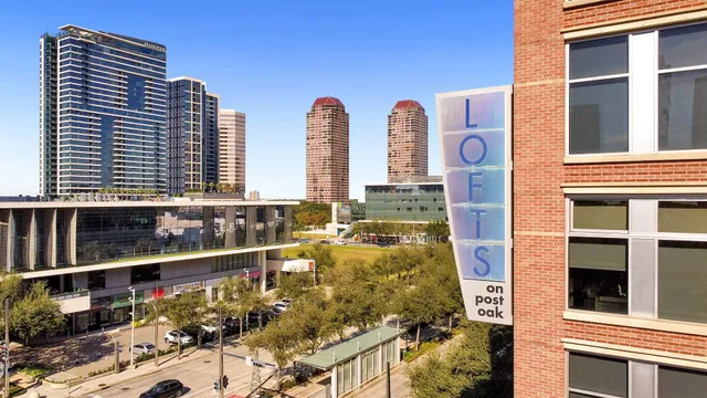 a front view of a residential apartment building with a yard