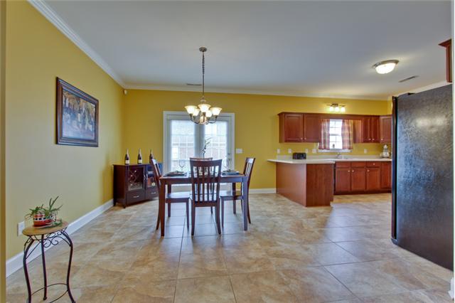 820 Renaissance Avenue Murfreesboro, TN 37129 - Photo 7 of 19 Plan a quiet dinner or entertain your guests here. Note the natural stone look of the 18" tile used throughout the dining area and kitchen.
