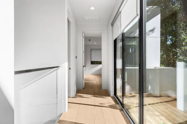 a bedroom with a large bed and a large window