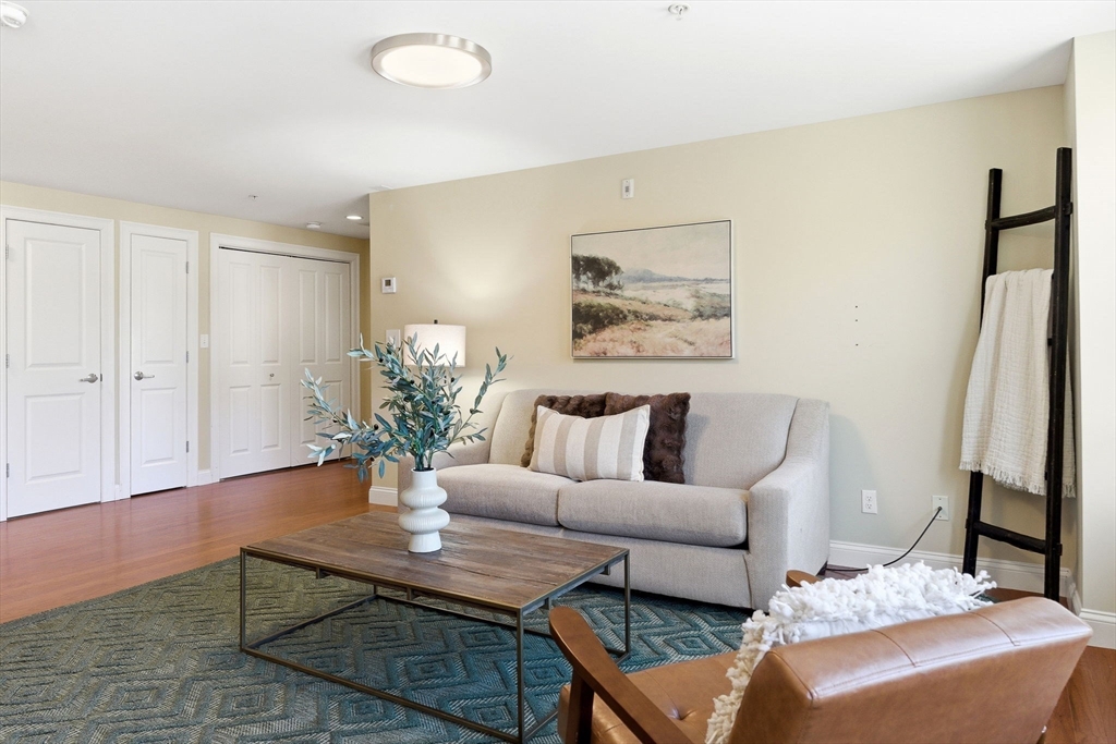 70 Great Road, Unit G Bedford, MA 01730 - Photo 6 of 15 a living room with furniture and a potted plant