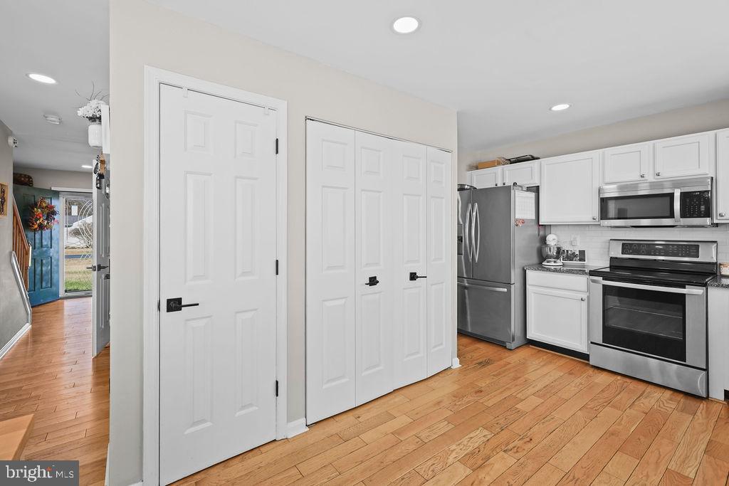 4445 Rolling Acres Drive Hurlock, MD 21643 - Photo 12 of 35 a kitchen with stainless steel appliances a refrigerator and a stove top oven
