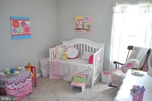 a bed room with a bed and window