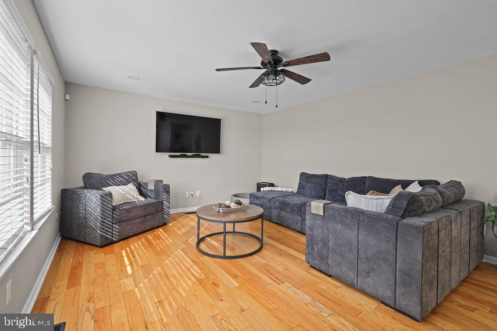 4445 Rolling Acres Drive Hurlock, MD 21643 - Photo 15 of 35 a living room with furniture and a flat screen tv