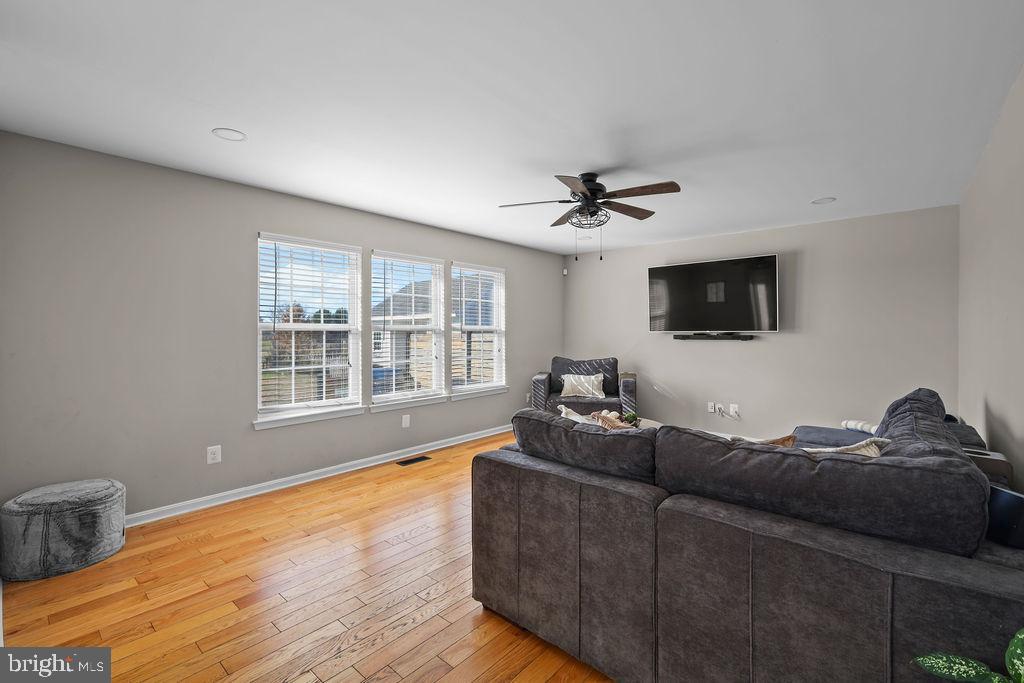 4445 Rolling Acres Drive Hurlock, MD 21643 - Photo 16 of 35 a living room with furniture and a flat screen tv