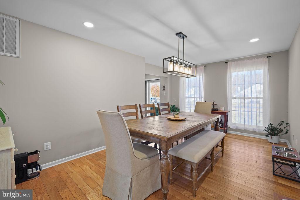 4445 Rolling Acres Drive Hurlock, MD 21643 - Photo 17 of 35 a view of a dining room with furniture window and wooden floor