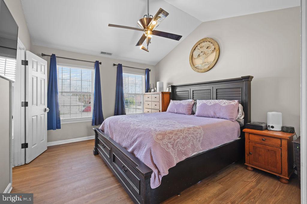 4445 Rolling Acres Drive Hurlock, MD 21643 - Photo 20 of 35 a bedroom with a bed and a chandelier