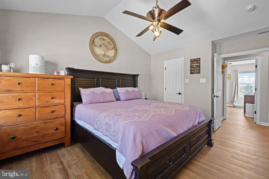 4445 Rolling Acres Drive Hurlock, MD 21643 - Photo 22 of 35 a bed room with a bed and a chandelier