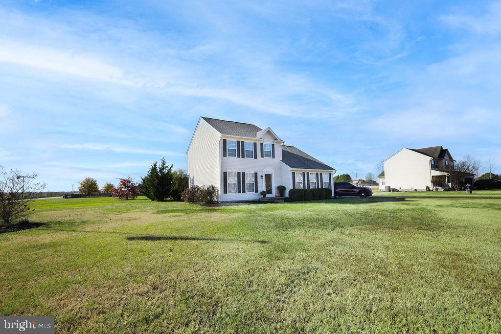 4445 Rolling Acres Drive Hurlock, MD 21643 - Photo 3 of 35 a view of a big house with a big yard and large trees