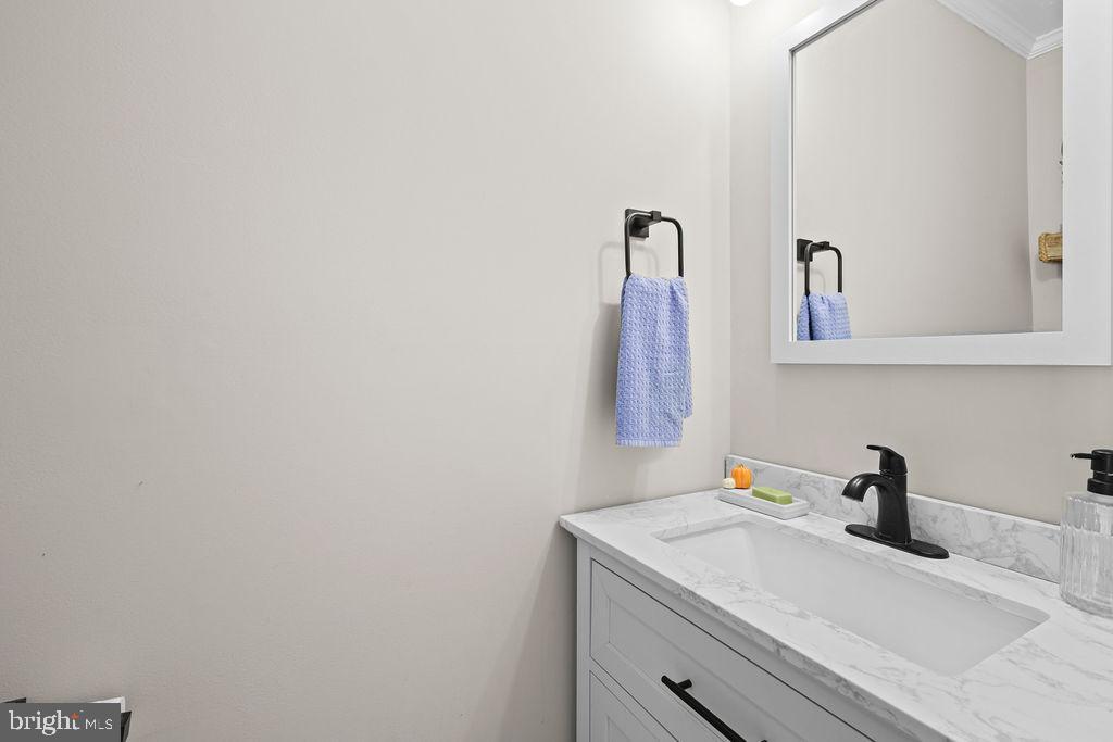 4445 Rolling Acres Drive Hurlock, MD 21643 - Photo 30 of 35 a bathroom with a sink and a mirror