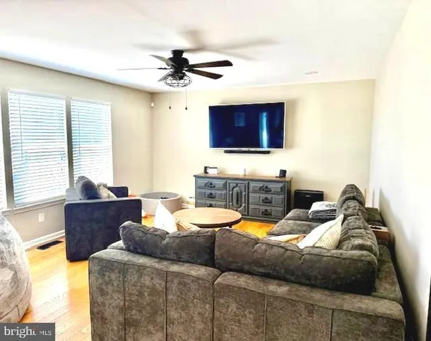 a view of backyard with sitting area and seating space