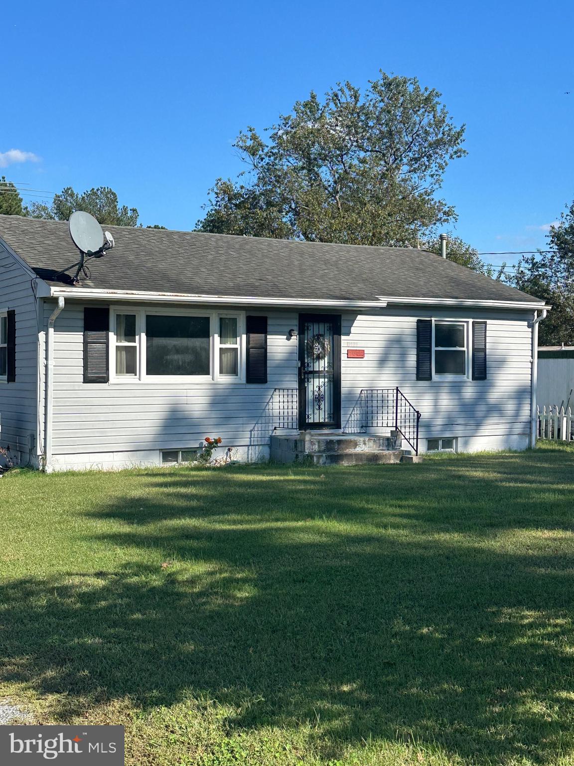 7009 Beulah Road Hurlock, MD 21643 - Photo 1 of 29 a front view of house with yard and green space