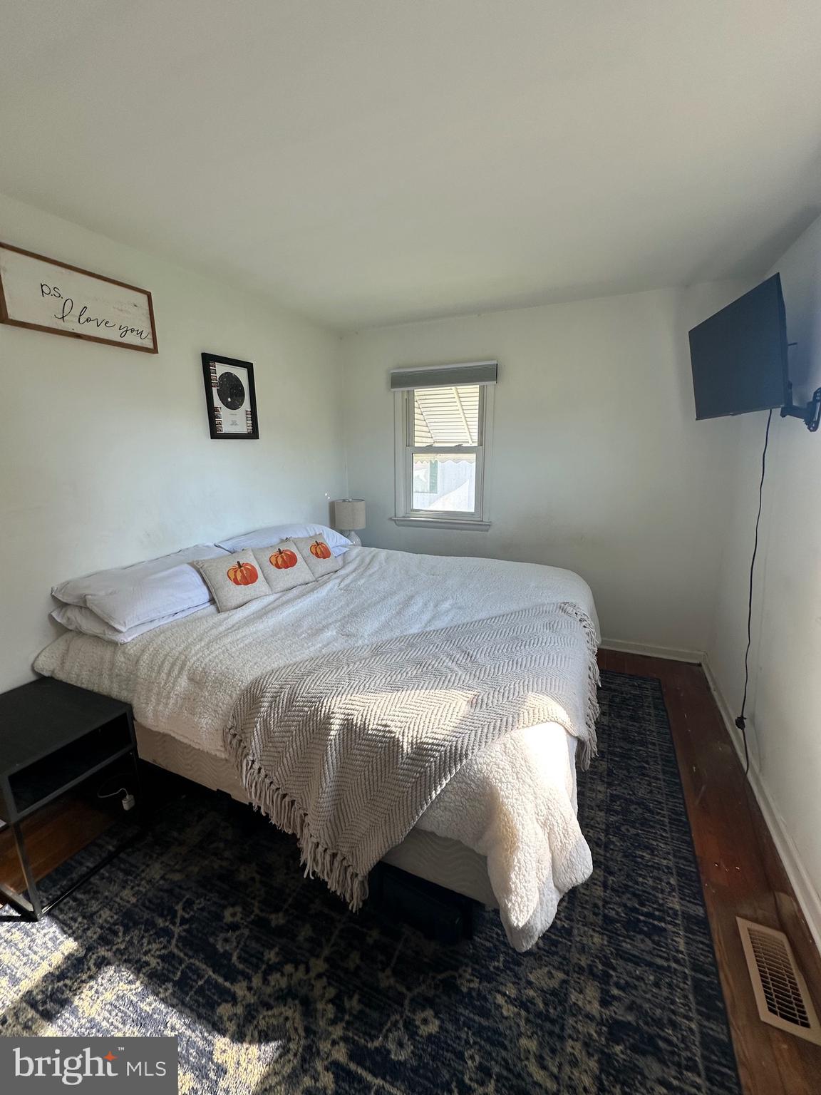 7009 Beulah Road Hurlock, MD 21643 - Photo 13 of 29 a bedroom with a bed and a window