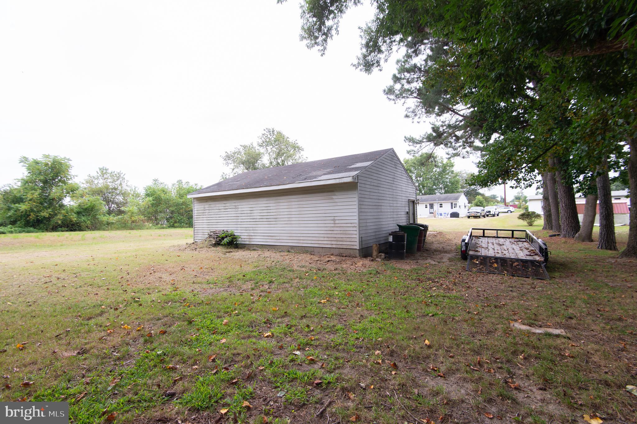 7009 Beulah Road Hurlock, MD 21643 - Photo 19 of 29 a view of backyard with barbeque grill and stairs
