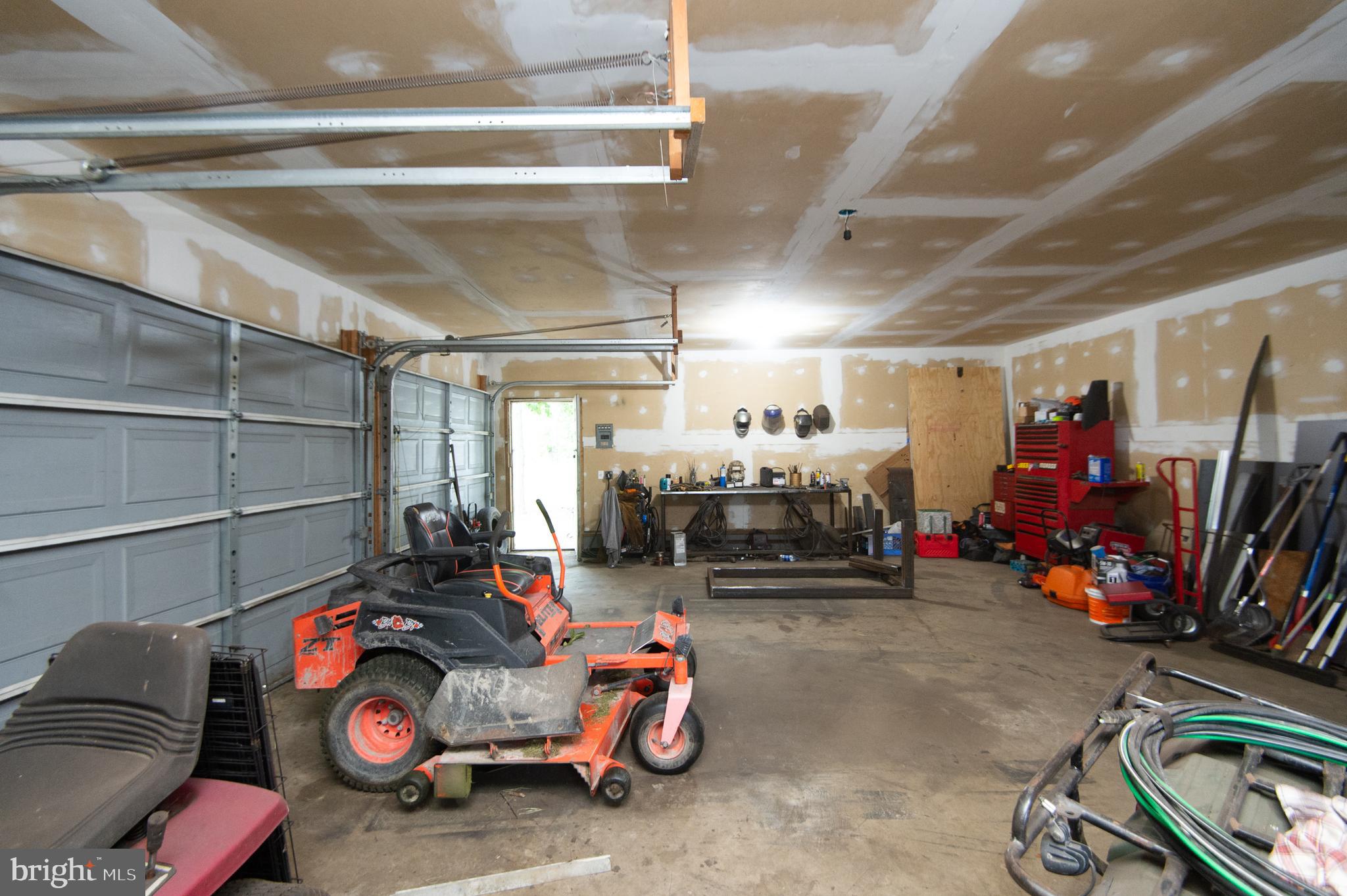 7009 Beulah Road Hurlock, MD 21643 - Photo 20 of 29 a view of a garage with a bike and car