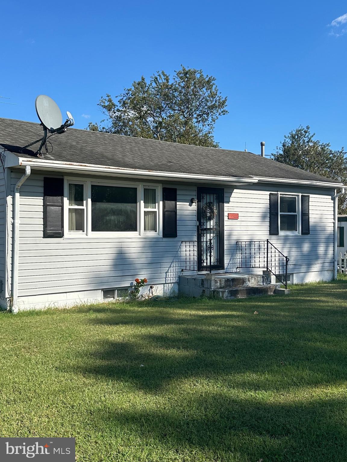 7009 Beulah Road Hurlock, MD 21643 - Photo 2 of 29 a front view of a house with a garden