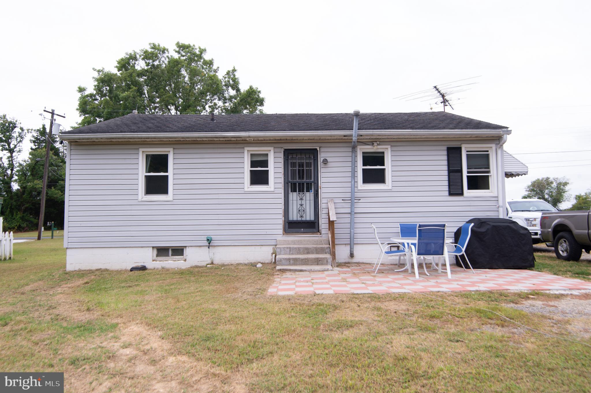 7009 Beulah Road Hurlock, MD 21643 - Photo 22 of 29 a view of a house with a yard and sitting area