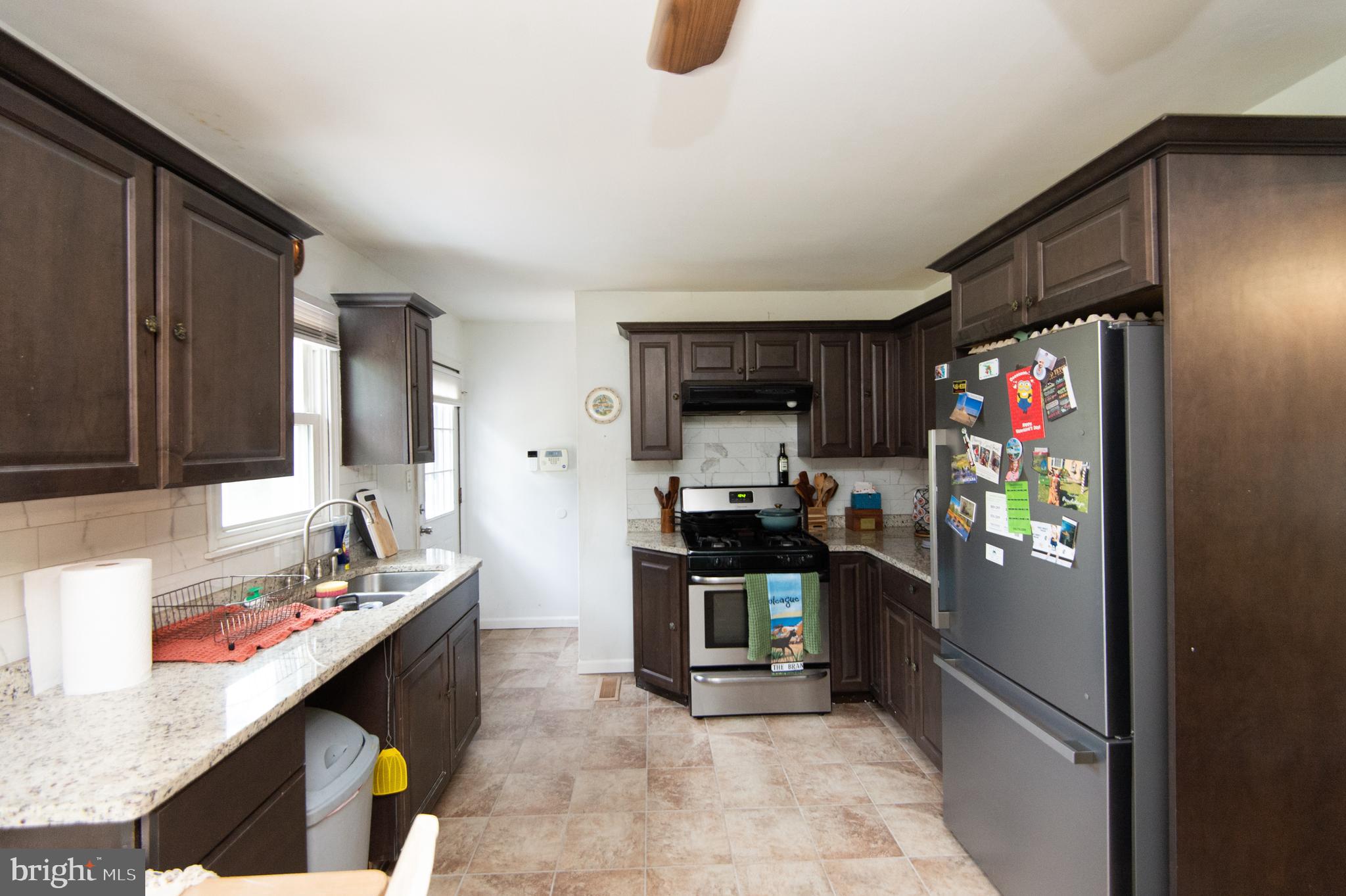 7009 Beulah Road Hurlock, MD 21643 - Photo 4 of 29 a kitchen with stainless steel appliances granite countertop a refrigerator and a stove