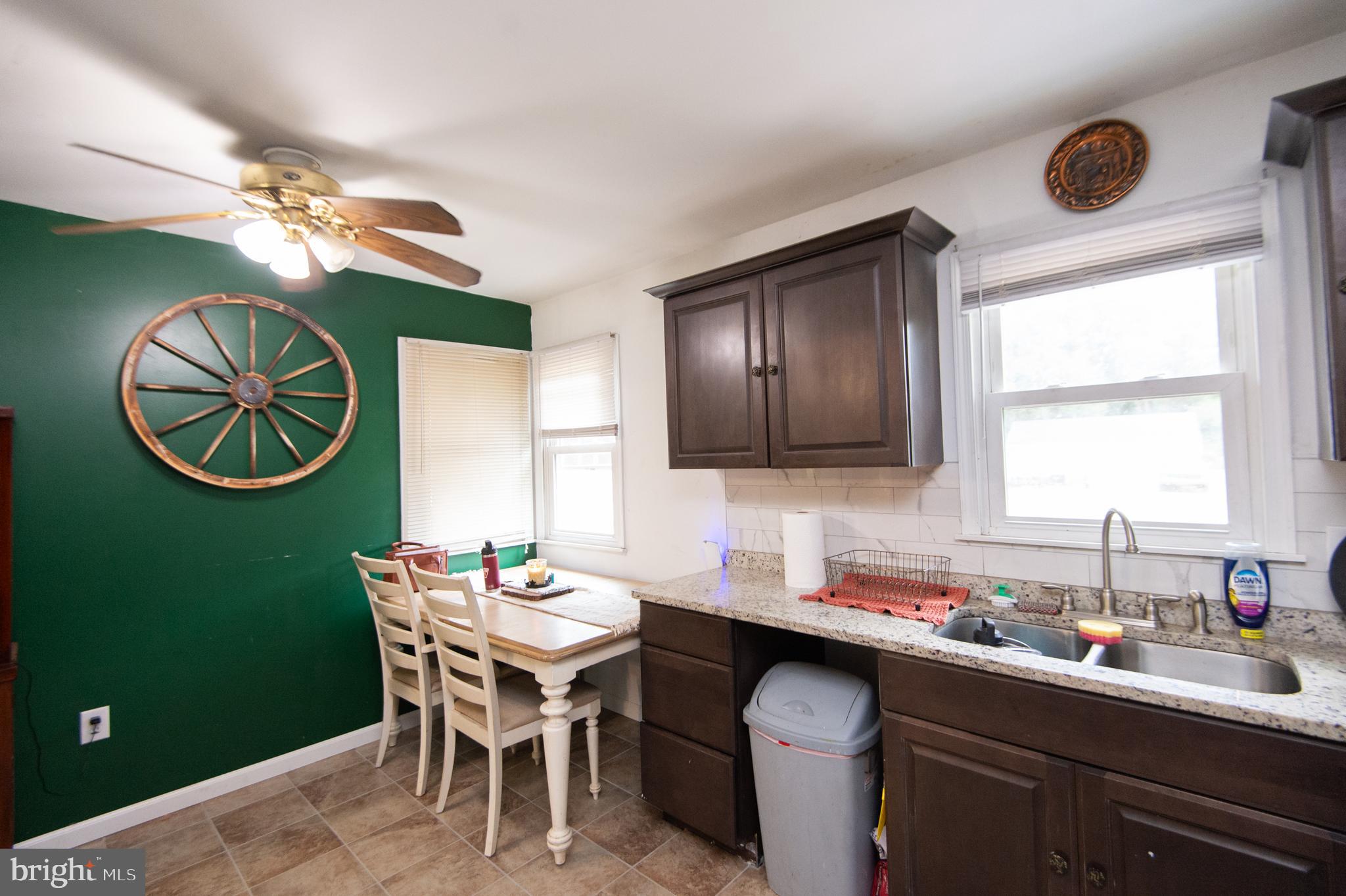 7009 Beulah Road Hurlock, MD 21643 - Photo 5 of 29 a kitchen with a dining table and chairs