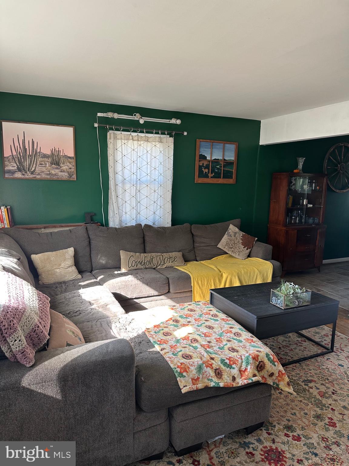 7009 Beulah Road Hurlock, MD 21643 - Photo 8 of 29 a bed sitting in a bedroom next to a window with a projector and screen