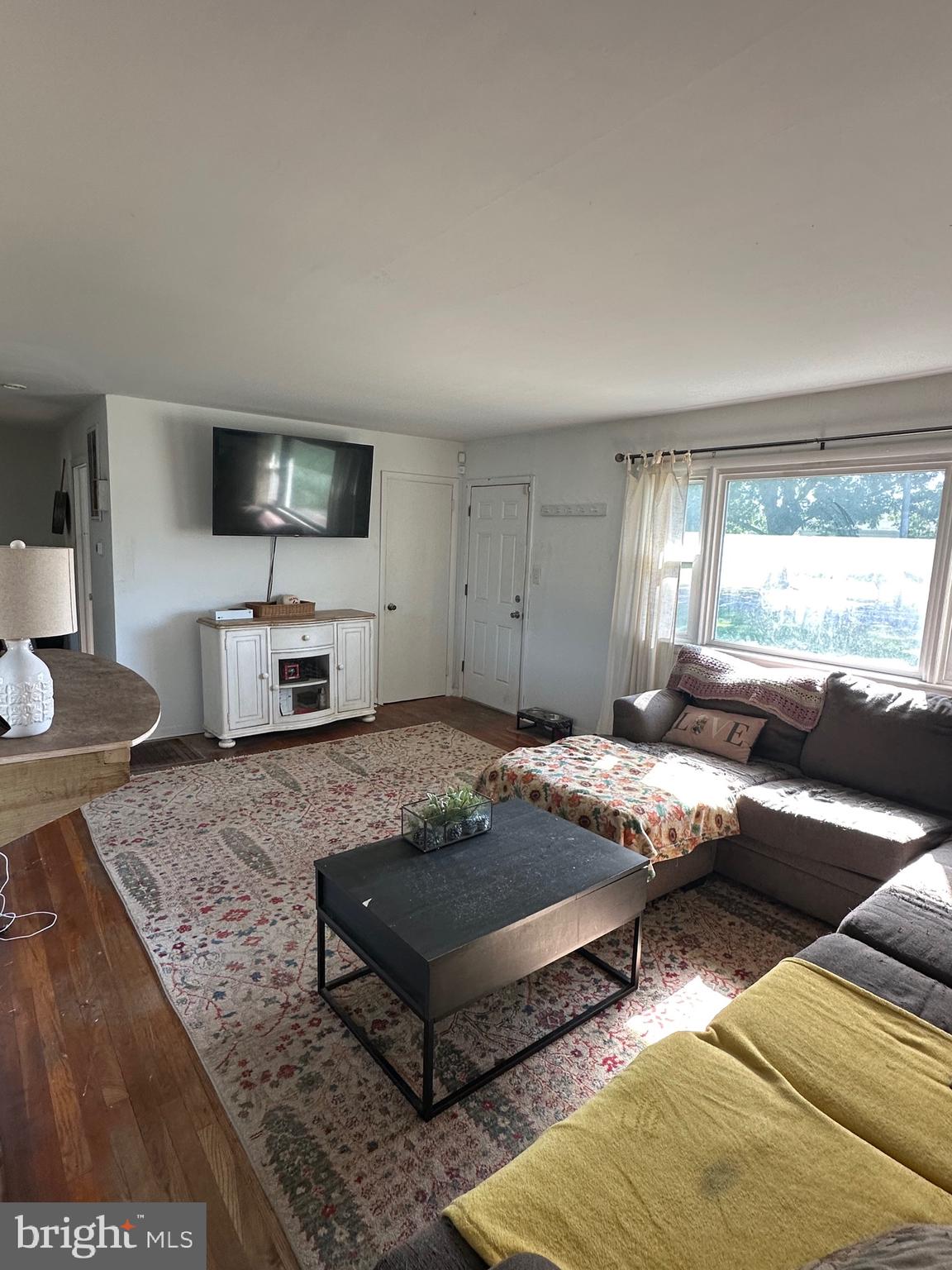 7009 Beulah Road Hurlock, MD 21643 - Photo 9 of 29 a living room with furniture and a flat screen tv