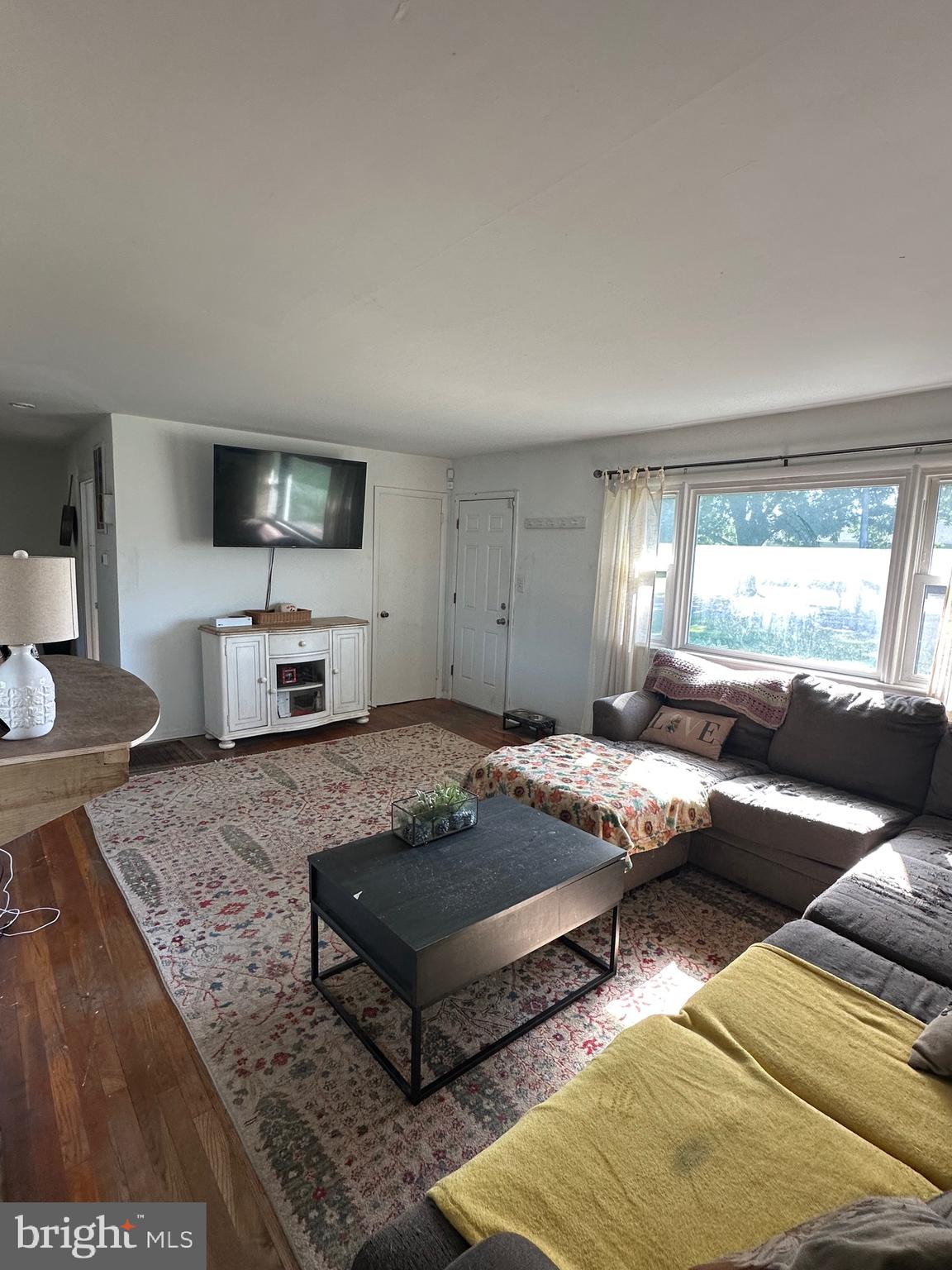 7009 Beulah Road Hurlock, MD 21643 - Photo 10 of 29 a living room with furniture and a flat screen tv