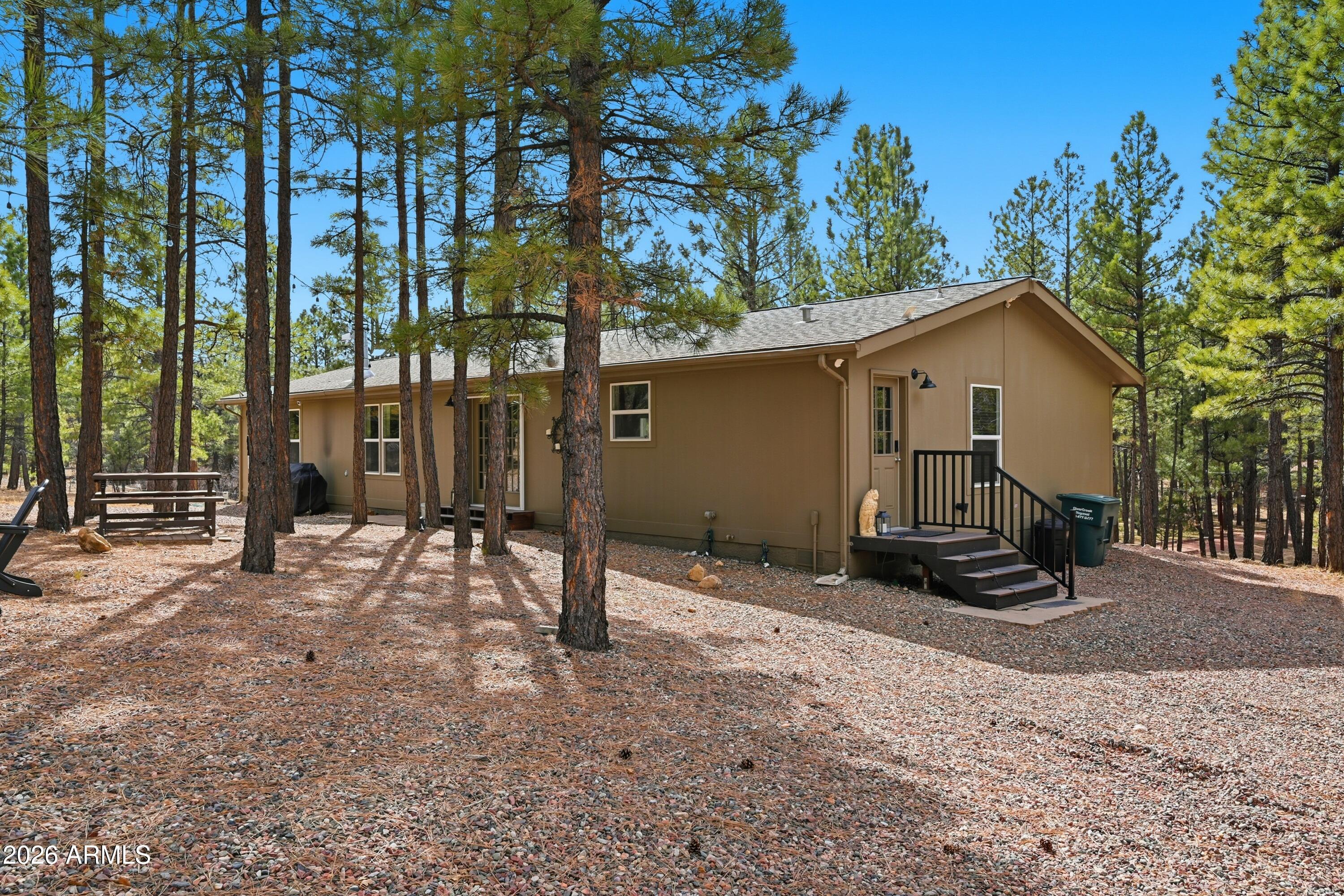 2381 Blue Ridge Drive Happy Jack, AZ 86024 - Photo 31 of 45 a view of a house with a yard