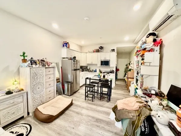 a view of a livingroom with furniture and a wooden floor