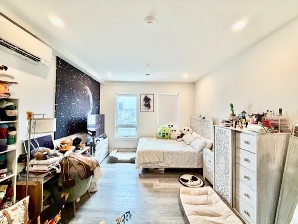 a bedroom with furniture and a chandelier