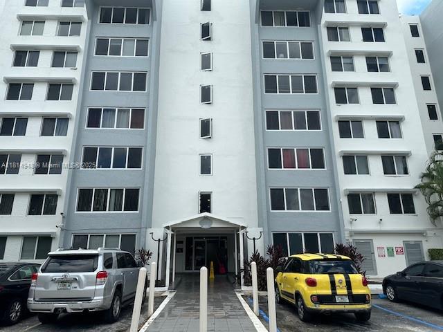 a view of a cars parked in front of a building