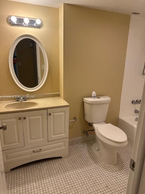9001 Southwest 77th Avenue, Unit C705 Miami, FL 33156 - Photo 10 of 11 a bathroom with a toilet and a sink