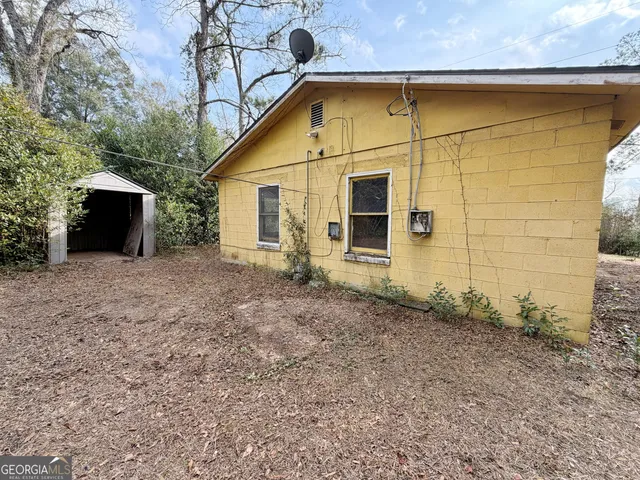 a view of house with backyard and entertaining space
