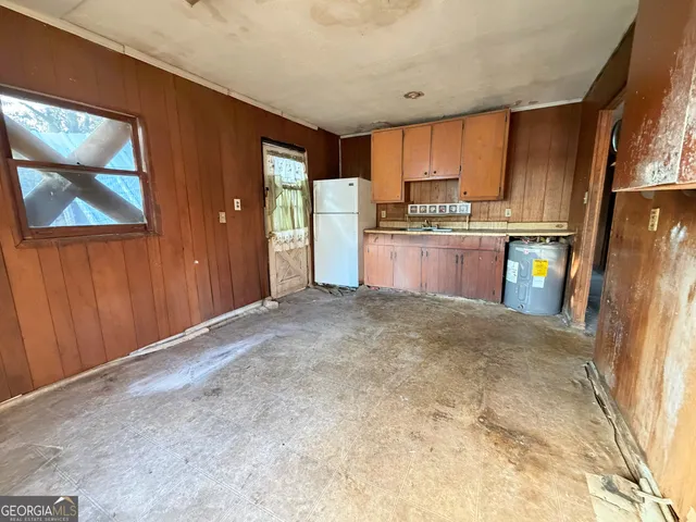 a view of a kitchen with a sink and cabinets