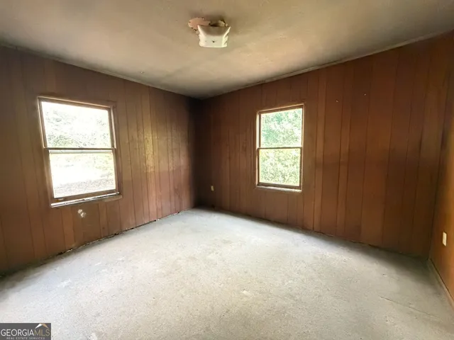 an empty room with windows