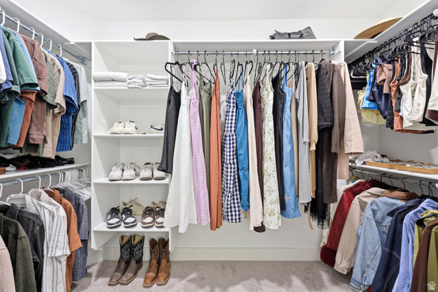 4646 Alder Drive, Unit 223 Mapleton, UT 84664 - Photo 14 of 35 Custom closet system featuring white shelving, multiple hanging rods, and integrated shoe storage