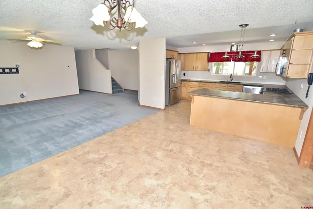 en view of kitchen and kitchen with granite countertop cabinets