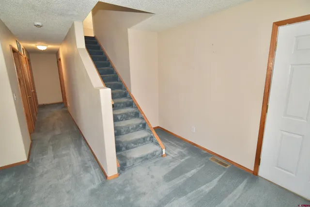 a view of a hallway with staircase