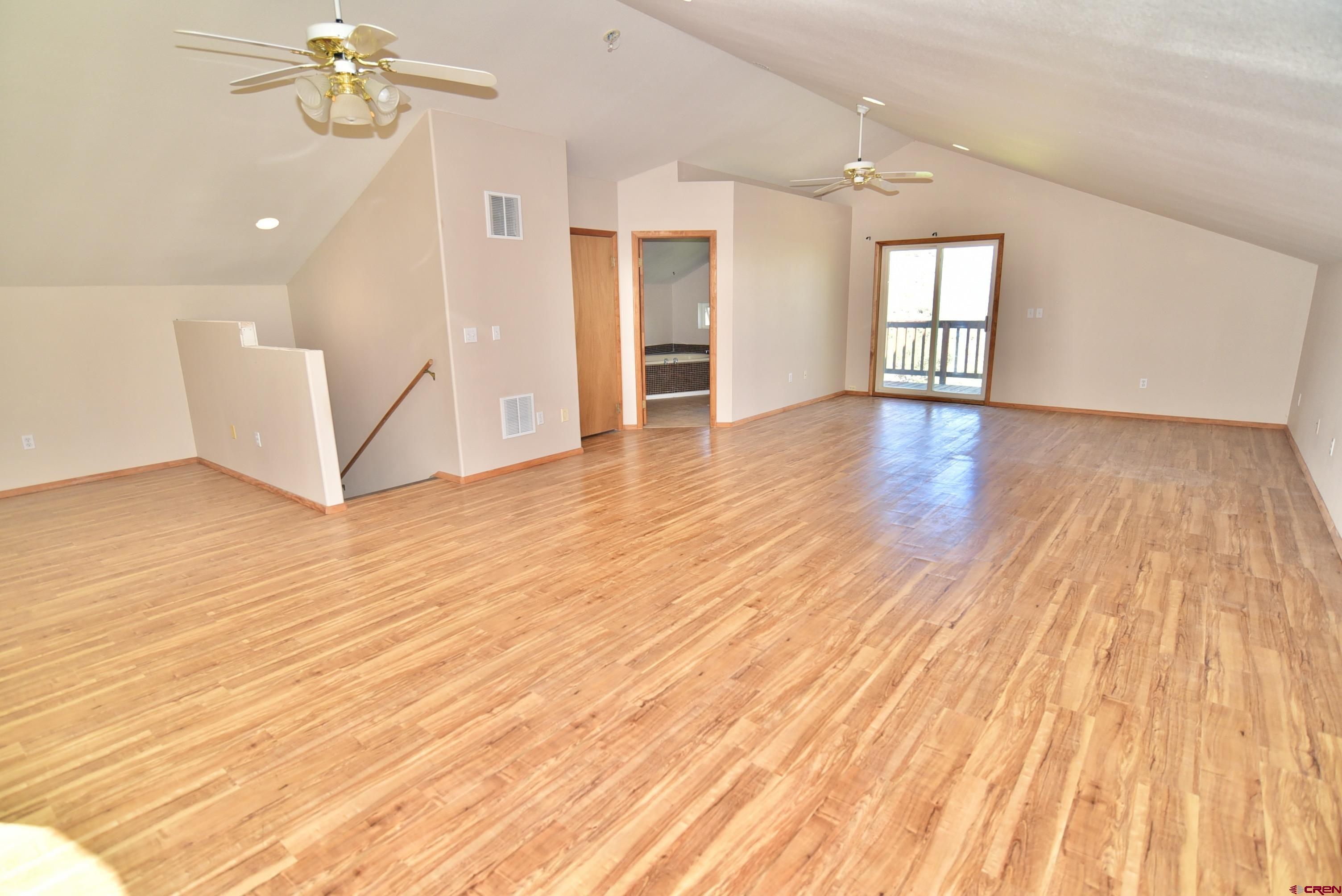 68600 Kinikin Road Montrose, CO 81403 - Photo 19 of 44 wooden floor in an empty room with a window