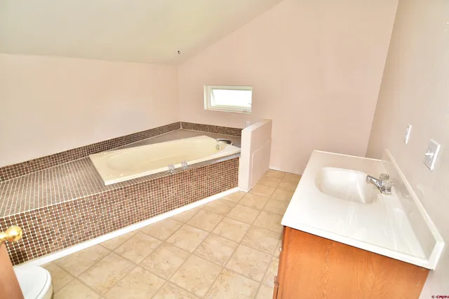 a bathroom with a bathtub and shower