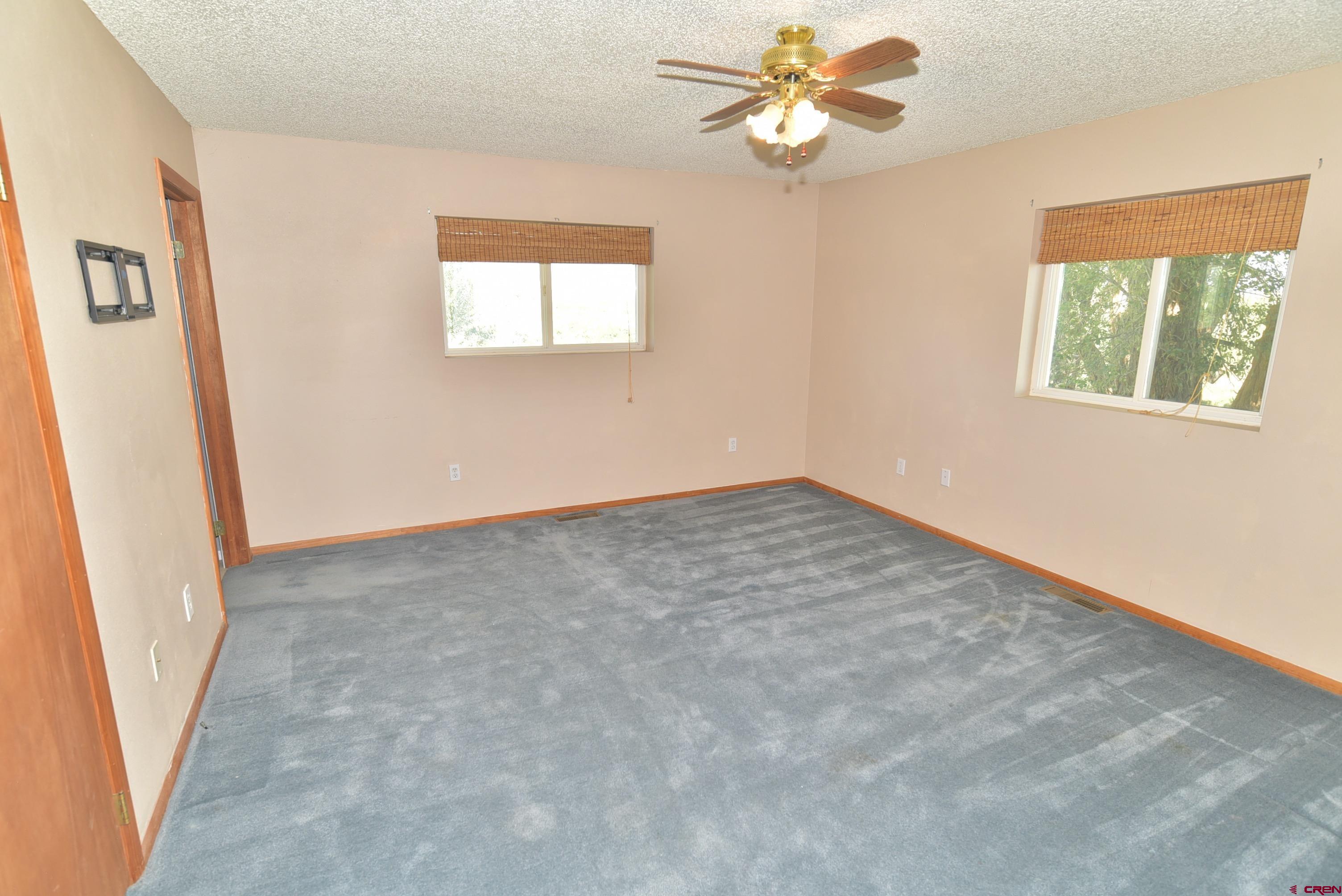 68600 Kinikin Road Montrose, CO 81403 - Photo 22 of 44 wooden floor in an empty room with a window