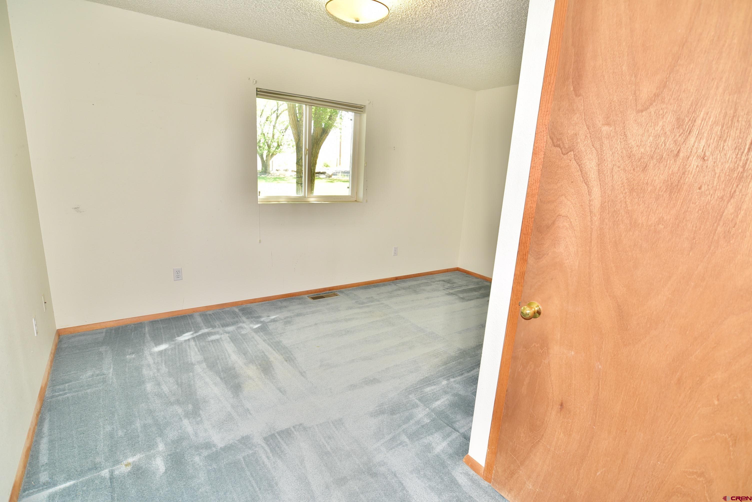 68600 Kinikin Road Montrose, CO 81403 - Photo 24 of 44 an empty room with windows