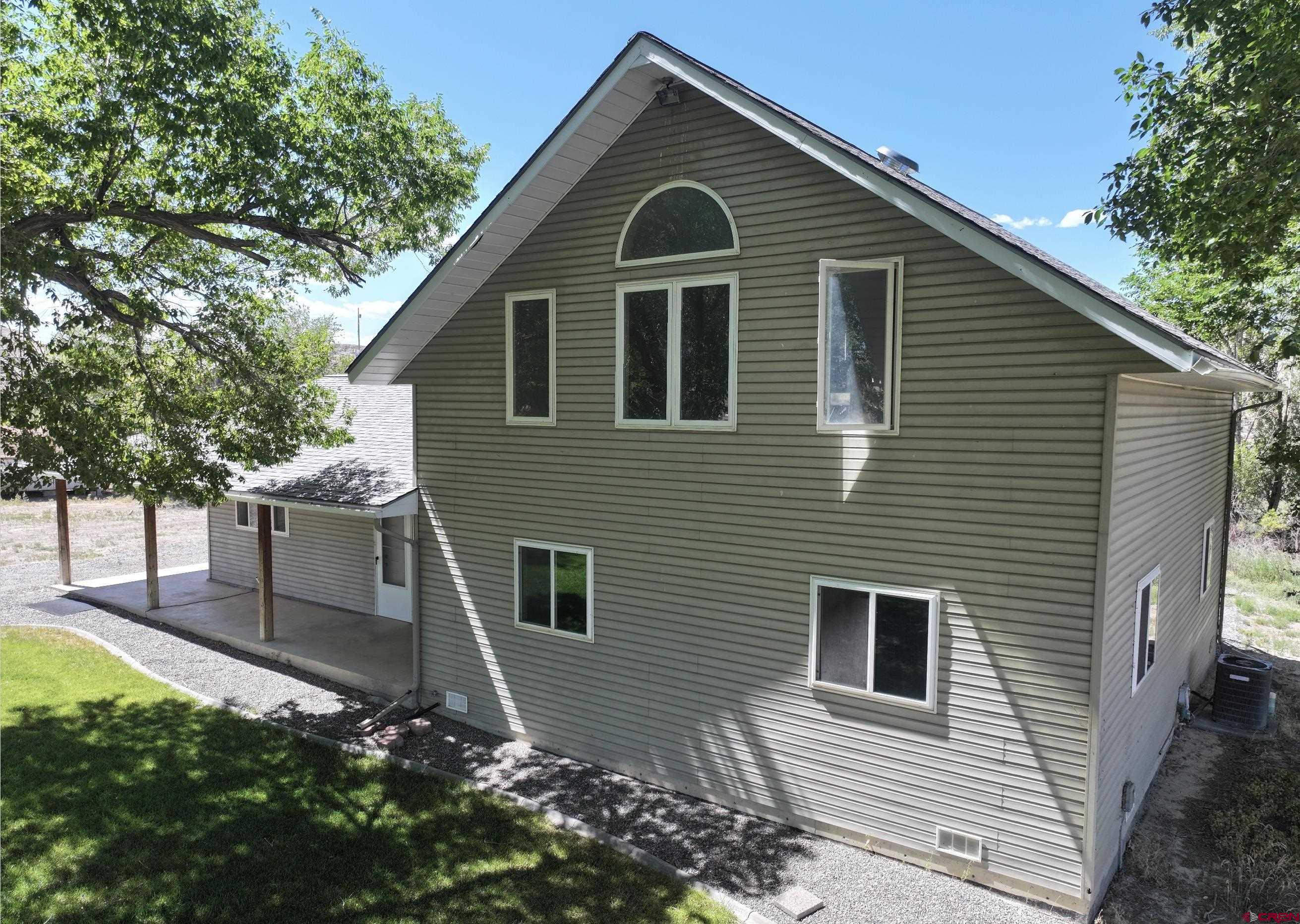 68600 Kinikin Road Montrose, CO 81403 - Photo 35 of 44 a front view of a house with garden
