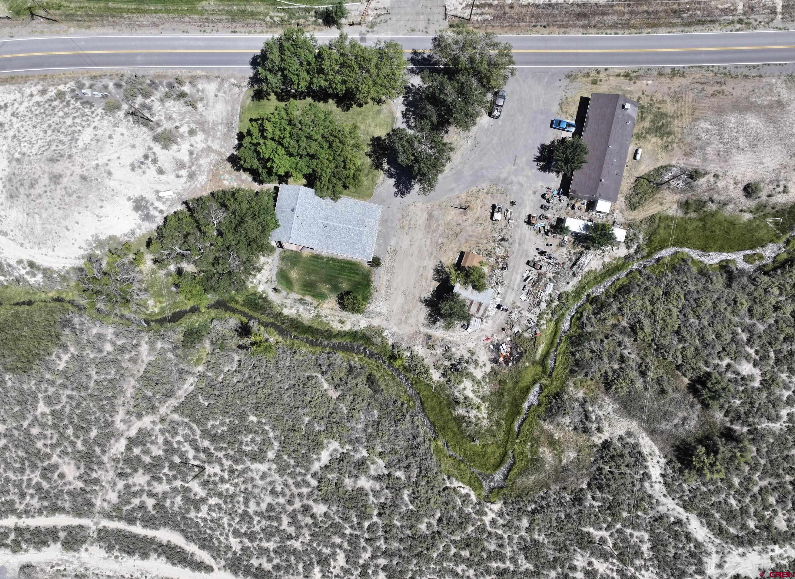 68600 Kinikin Road Montrose, CO 81403 - Photo 40 of 44 an aerial view of a house with a yard
