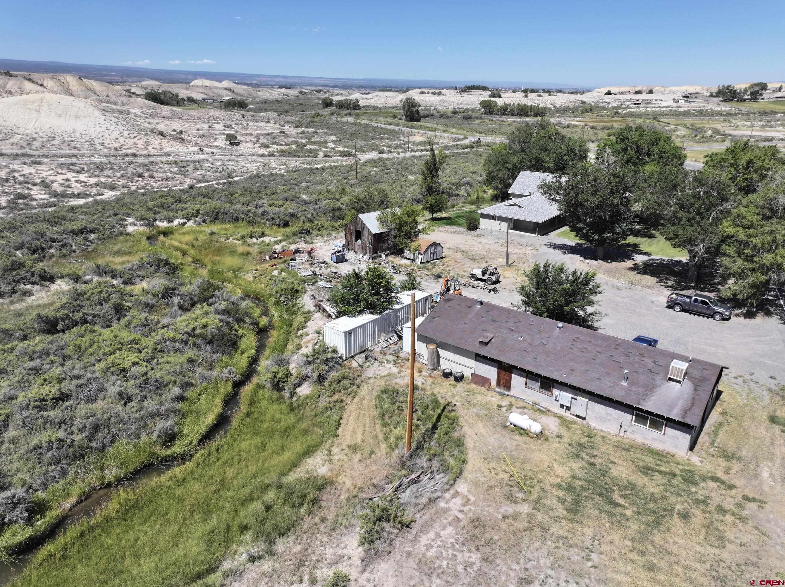 68600 Kinikin Road Montrose, CO 81403 - Photo 41 of 44 an aerial view of a house with a yard